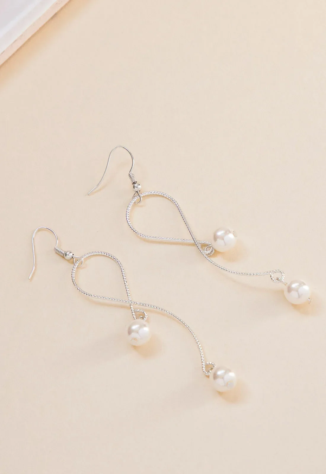 Always Chic Silver Pearl Snake Chain Earrings - Image 4